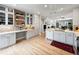 Well-lit kitchen with modern appliances and easy access to the living area at 7722 E 6Th Pl, Denver, CO 80230
