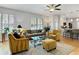 Inviting living room with hardwood floors and plenty of natural light at 7722 E 6Th Pl, Denver, CO 80230