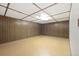 Unfinished basement featuring wood paneling at 10868 W 70Th Ave, Arvada, CO 80004