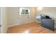 Bedroom featuring hardwood floors, natural light, and neutral walls at 10868 W 70Th Ave, Arvada, CO 80004