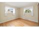Bright bedroom with hardwood floors, natural light, and neutral walls at 10868 W 70Th Ave, Arvada, CO 80004