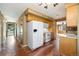 Spacious kitchen with hardwood floors, white appliances, and ample cabinet space at 10868 W 70Th Ave, Arvada, CO 80004