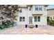 Backyard with patio, small garden, and cream-colored siding at 2334 Yosemite St, Denver, CO 80238