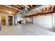 Unfinished basement with exposed beams, ductwork, and ample open space at 2334 Yosemite St, Denver, CO 80238