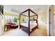 A spacious bedroom with a four-poster bed, and bright windows at 2334 Yosemite St, Denver, CO 80238