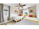 Bedroom featuring two twin beds and decoratively draped windows at 2334 Yosemite St, Denver, CO 80238