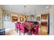 An expansive dining room blends seamlessly with an open kitchen and living area at 2334 Yosemite St, Denver, CO 80238