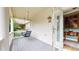 Charming covered front porch with swing and view into the home's entry at 2334 Yosemite St, Denver, CO 80238