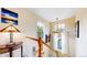 Bright hallway with staircase, natural light from windows, complemented by tasteful decor at 2334 Yosemite St, Denver, CO 80238