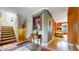 Welcoming hallway features wood floors, staircase, and tasteful decor at 2334 Yosemite St, Denver, CO 80238