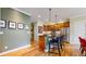 Modern kitchen features an island, wood cabinets, and stainless steel appliances at 2334 Yosemite St, Denver, CO 80238
