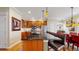 Well-equipped kitchen featuring wooden cabinets, black countertops, and an eat-in breakfast bar at 2334 Yosemite St, Denver, CO 80238