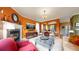 Spacious living room featuring a fireplace, plush seating, and seamless flow to other living areas at 2334 Yosemite St, Denver, CO 80238