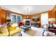 Stylish living room with fireplace, ample seating, and a large window for natural light at 2334 Yosemite St, Denver, CO 80238