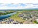 Enjoy this aerial view of the neighborhood, showcasing nearby lakes and stunning mountain views at 5045 Preserve Pl, Firestone, CO 80504