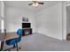 Bedroom offering gray carpet, white trim, closet with sliding doors and television on a fireplace at 5045 Preserve Pl, Firestone, CO 80504
