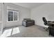 Bedroom with carpet, small couch, desk, window and a chair at 5045 Preserve Pl, Firestone, CO 80504