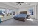 Spacious main bedroom with tray ceiling, large windows, and carpet at 5045 Preserve Pl, Firestone, CO 80504