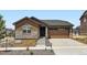 Charming single-Gathering home featuring a stone facade and a two-car garage at 21935 E 39Th Pl, Aurora, CO 80019