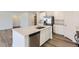 Modern kitchen featuring white cabinets, stainless steel appliances and a large island at 21935 E 39Th Pl, Aurora, CO 80019