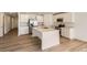 Modern kitchen featuring white cabinets, stainless steel appliances and a large island at 21935 E 39Th Pl, Aurora, CO 80019