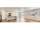Bright, open-concept living space with wood floors and large windows at 21935 E 39Th Pl, Aurora, CO 80019