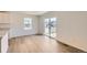 Bright, open-concept living space with wood floors and access to the patio at 21935 E 39Th Pl, Aurora, CO 80019