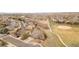 Aerial view showcasing the property's location near walking paths, a field, and neighborhood amenities at 21062 E Mansfield Pl, Aurora, CO 80013