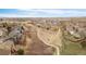 A drone view of a large neighborhood with winding paths and extensive open space at 21062 E Mansfield Pl, Aurora, CO 80013