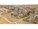 A drone view showing the house, yard, neighborhood, and proximity to walking paths at 21062 E Mansfield Pl, Aurora, CO 80013