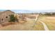 Backyard view showing fenced yard, open space and proximity to walking path and baseball field at 21062 E Mansfield Pl, Aurora, CO 80013