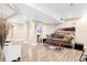 Spacious basement with stylish flooring, comfortable seating, and neutral tones, ideal for relaxing and entertaining at 21062 E Mansfield Pl, Aurora, CO 80013