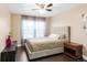 Comfortable bedroom with a cushioned headboard, neutral decor, and warm hardwood floors, a peaceful retreat at 21062 E Mansfield Pl, Aurora, CO 80013