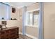Cozy bedroom with blue curtains, a wooden dresser, and personal touches to create a comfortable space at 21062 E Mansfield Pl, Aurora, CO 80013