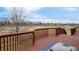 Spacious wooden deck with great view of neighborhood and surrounding landscape on a sunny day at 21062 E Mansfield Pl, Aurora, CO 80013