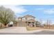 Charming two-story home featuring a three car garage, mature trees and manicured lawn in a suburban neighborhood at 21062 E Mansfield Pl, Aurora, CO 80013
