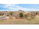 Back of house with a deck overlooking a large lot with a wooden fence and proximity to open space at 21062 E Mansfield Pl, Aurora, CO 80013