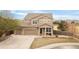 Charming two-story home featuring a three-car garage and a welcoming front porch at 21062 E Mansfield Pl, Aurora, CO 80013