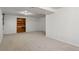 Finished basement with carpet flooring and built-in shelving at 4638 S Mobile Way, Aurora, CO 80015