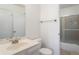 Bright white bathroom with a sink, toilet, and shower at 4638 S Mobile Way, Aurora, CO 80015