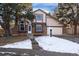 Inviting two-story home featuring a classic brick and siding exterior with a two-car garage and manicured front yard at 4638 S Mobile Way, Aurora, CO 80015