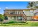 View of a two story home featuring a wooden deck at 18771 Mexico E Dr, Aurora, CO 80017