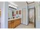 Bathroom featuring a dual sink vanity, and a separate toilet and shower area at 18771 Mexico E Dr, Aurora, CO 80017