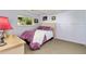 Cozy bedroom with a comfortable bed, dresser, and a view of the backyard at 18771 Mexico E Dr, Aurora, CO 80017