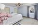 Comfortable bedroom with a ceiling fan, closet, and large window at 18771 Mexico E Dr, Aurora, CO 80017