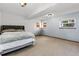 Bedroom features neutral carpet, light blue walls, and natural light from two windows at 18771 Mexico E Dr, Aurora, CO 80017