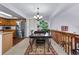 Open dining room with stainless steel refrigerator at 18771 Mexico E Dr, Aurora, CO 80017