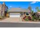 Charming single-story home with a well-manicured lawn and attached garage at 18771 Mexico E Dr, Aurora, CO 80017