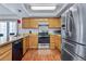 A kitchen featuring wooden cabinets at 18771 Mexico E Dr, Aurora, CO 80017