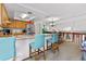 Open kitchen featuring a breakfast bar with seating and skylight at 18771 Mexico E Dr, Aurora, CO 80017